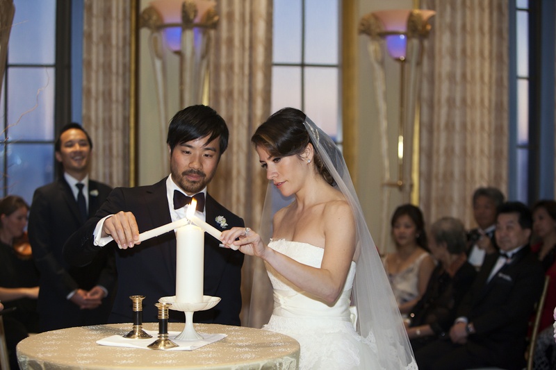 Unity Candle Ceremony
Photography: Catherine Hall Studios
Read More:
http://www.insideweddings.com/weddings/metropolitan-san-francisco-wedding-at-luxury-hotel/411/ Bride and groom at wedding lighting pillar candle