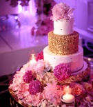 Wedding Cake with Gold Tier %26 Peony
Photography: Alakija Studios
Read More:
http://www.insideweddings.com/weddings/fairy-tale-wedding-with-vibrant-blush-fuchsia-gold-decor/1252/ wedding cake with gold rosette design quilted rhinestone design and gold tier pink peony flowers