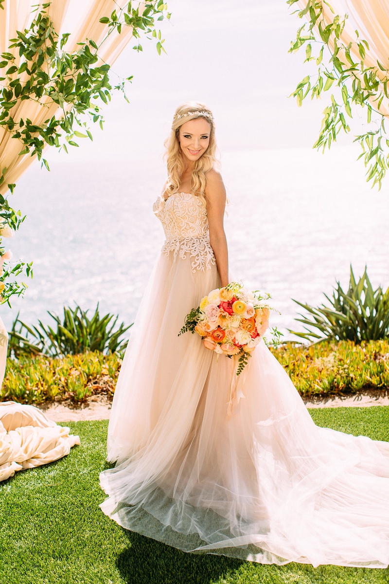 Stunning Summer Bride in Custom Gown
Photography: Ashley Paige Photography
Read More:
http://www.insideweddings.com/weddings/romantic-ocean-view-ceremony-charming-reception-in-california/1337/ bride under drapery greenery wedding ceremony overlooking ocean custom trish peng wedding dress