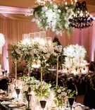 Ivory %26 Greenery Centerpiece on Mirror Table
Photography: Brett Hickman Photographers
Read More:
http://www.insideweddings.com/weddings/charlise-castro-and-george-springer-iii/1165/ Charlise Castro and Houston Astros mlb player George Springer III wedding reception table