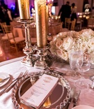 Gold %26 White Menu on Mirrored Charger
Photography: Travis Harris Photography
Read More:
http://www.insideweddings.com/weddings/romantic-wedding-with-ivory-champagne-gold-palette-in-florida/709/ Wedding reception sweetheart table with mirror chargers, gold pillar candles on mercury glass stands