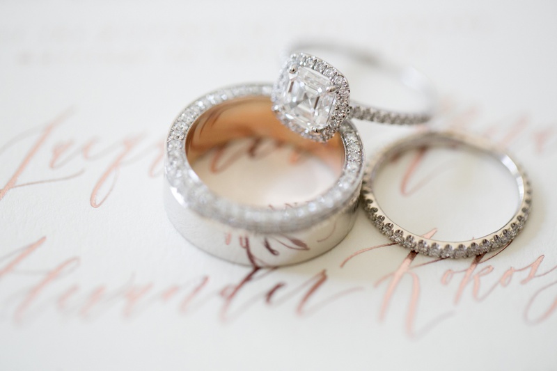 Asscher-Cut Diamond Ring
Photography: Michael Segal Photography
Read More:
http://www.insideweddings.com/weddings/alfresco-wedding-with-a-rose-inspired-palette-at-a-ranch-in-malibu/1251/ asscher-cut diamond engagement ring in halo, men's wedding ring with hidden channel-set diamonds