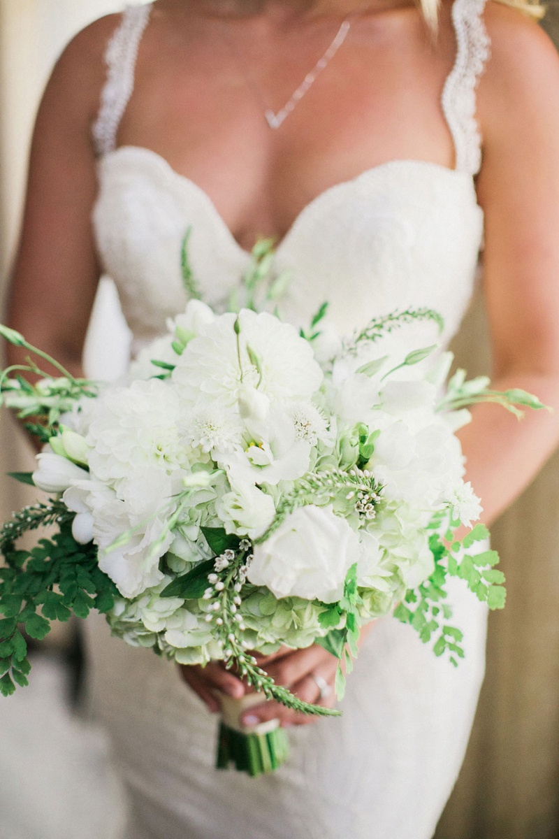 Loosely Structured Bouquet with Greenery
Photography: This Modern Romance
Read More:
http://www.insideweddings.com/weddings/rustic-chic-wedding-with-wooden-accents-and-verdant-details/861/ bride in galia lahav holding bridal bouquet with white flowers and greenery