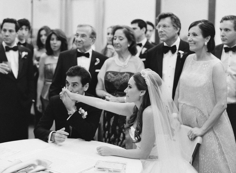 Groom Kisses Bride's Hand Before Ceremony
Photography: Kat Braman Photography
Read More:
http://www.insideweddings.com/weddings/a-sophisticated-museum-wedding-with-modern-details-in-palm-beach/899/ Black and white photo of groom kissing bride's hand at ketubah signing ceremony before wedding