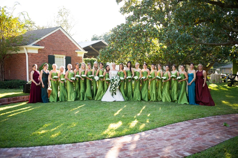 Floor-Length Green Bridesmaid Dresses
Photography: Chris Bailey Photography
Read More:
http://www.insideweddings.com/weddings/southern-at-home-wedding-inspired-by-father-of-the-bride-in-texas/753/ Bride in Isabelle Armstrong wedding dress with 18 bridesmaids in green dresses and red blue dresses