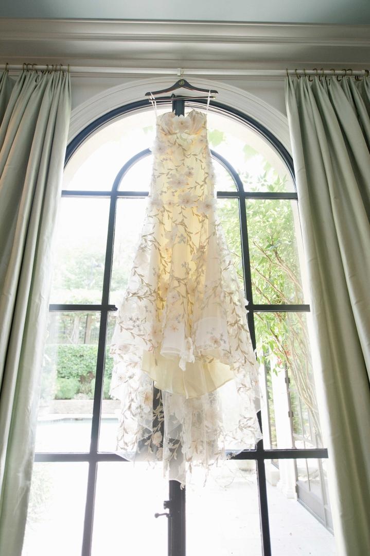 Flower Appliqué Dress
Photography: Harwell Photography
Read More:
http://www.insideweddings.com/weddings/romantic-woodland-inspired-atlanta-wedding-with-natural-details/433/ Claire Pettibone wedding dress hanging in window