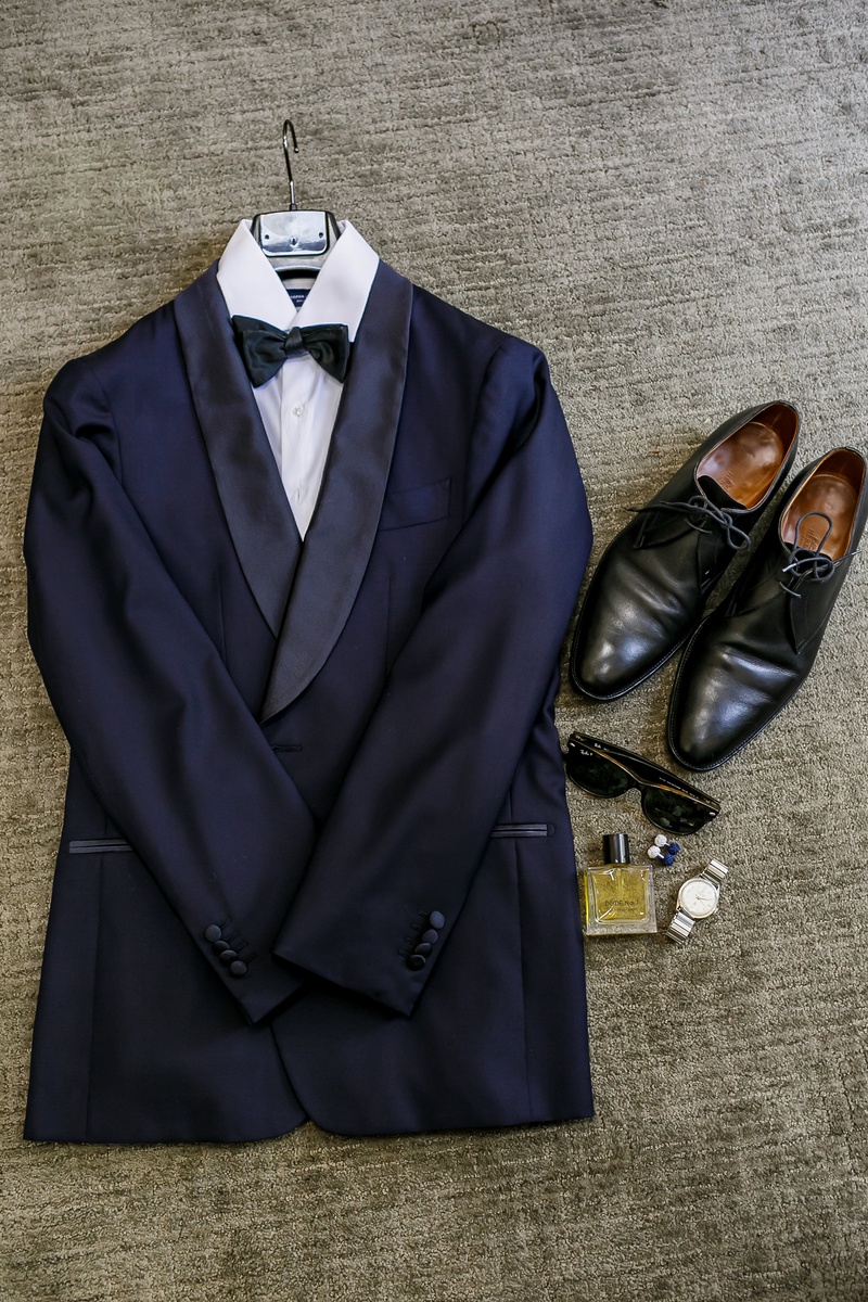 Groom's Wedding-Day Ensemble
Photography: Amy Anaiz Photography
Read More:
http://www.insideweddings.com/weddings/lakeside-wedding-with-blue-details-in-upstate-new-york/1140/ groom's navy tuxedo, dress shoes, sunglasses, cologne, watch, cuff links