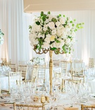 Fresh Florals on Gold Stand
Photography: Chard Photo
Read More:
http://www.insideweddings.com/weddings/alfresco-ceremony-on-the-coast-classic-ballroom-reception/1290/ white roses and eucalyptus leaves on thin gold stand