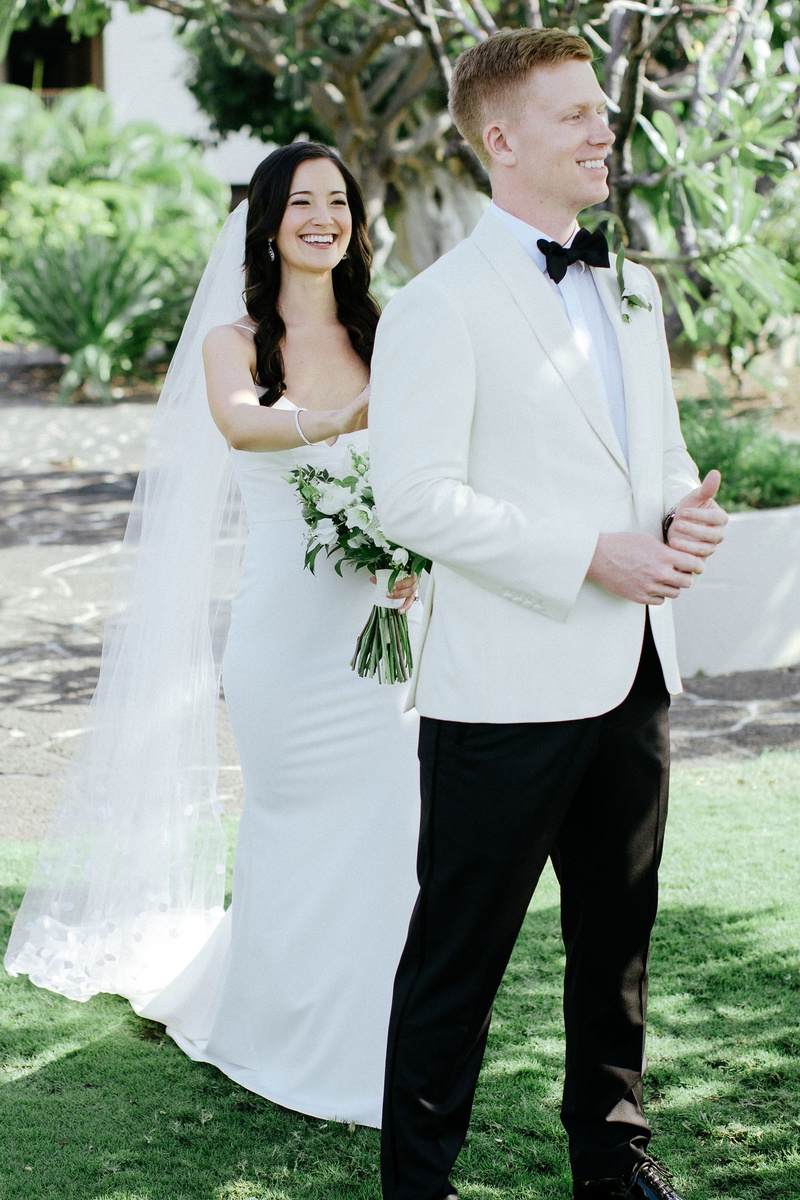 "First Look" at Destination Wedding
Photography: Chris J. Evans Photography
Read More:
http://www.insideweddings.com/weddings/outdoor-winter-ceremony-and-reception-on-the-big-island-in-hawaii/1306/ destination wedding in hawaii bride in crepe gown groom in white tuxedo jacket bow tie outdoor look