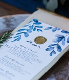 Gold Wax Seal on Menu Card
Photography: Leppert Photography
Read More:
http://www.insideweddings.com/weddings/autumnal-alfresco-garden-ceremony-tented-reception-in-cincinnati/1168/ White and blue watercolor design motif menu card calligraphy gold wax seal sprig of rosemary herbs