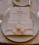 White and Ivory Place Setting
Photography: Lawrence Crandall Photography
Read More:
http://www.insideweddings.com/weddings/white-black-gold-oceanside-wedding-in-california/309/ Ritz-Carlton menu card and white orchid on napkin