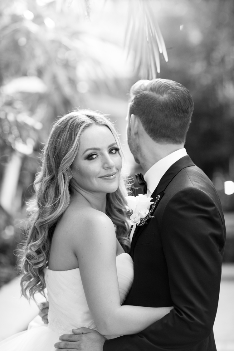 Bride Smiles While Holding Groom
Photography: Duke Photography
Read More:
http://www.insideweddings.com/weddings/jewish-ceremony-classic-ballroom-reception-in-beverly-hills/922/ black and white photo of bride smiling while groom looks away