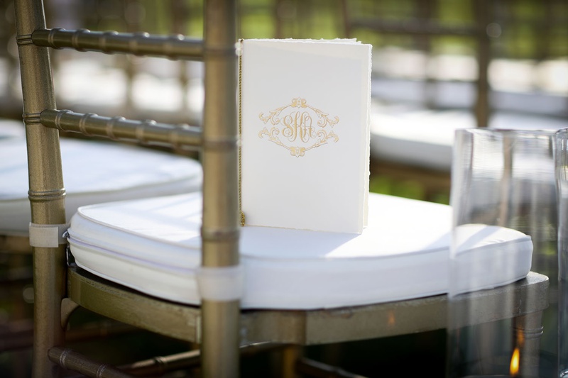 Gold Chair with Ceremony Program
Photography: Alain Martinez Photography
Read More:
http://www.insideweddings.com/weddings/opulent-luxury-wedding-with-white-gold-color-scheme-in-palm-beach/1375/ wedding ceremony program gold monogram booklet on white chair cushion gold chair