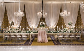 Elegant Hotel Ballroom Wedding Décor
Photography: Kent Drake Photography
Read More:
http://www.insideweddings.com/weddings/greek-orthodox-ceremony-romantic-ballroom-reception-in-chicago/1334/ wedding reception decor drapery chandelier long head table mirror clear chairs high low centerpieces
