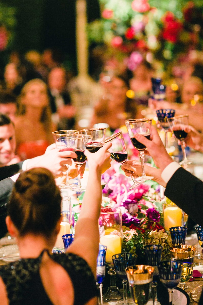 Guests Clinking Gold-Rim Glasses
Photography: Mi Belle Photographers
Read More:
http://www.insideweddings.com/weddings/colorful-outdoor-wedding-with-supper-club-theme-in-los-angeles-ca/741/ Wedding guests at tent wedding cheers and toast with gold rim wine goblets