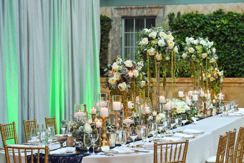 Long Table with White %26 Greenery Décor
Photography: Carasco Photography
Read More:
http://www.insideweddings.com/weddings/personalized-fairy-tale-wedding-with-fun-entertainment-in-chicago/1283/ wedding reception table white linen gold chair high low centerpiece greenery white rose navy runner