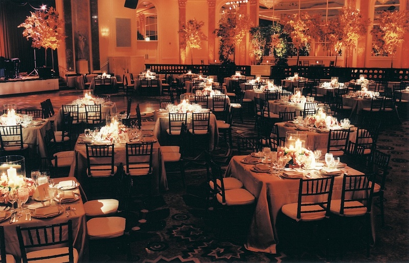 Autumn-Inspired Reception Space
Photography: Stephanie Ellis Photography
Read More:
http://www.insideweddings.com/weddings/fall-inspired-wedding-in-beverly-hills-california/41/ Ballroom of square tables and orange lighting