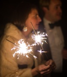 Wedding Sparklers
Photography: Liz Banfield and Adrienne Page
Read More:
http://www.insideweddings.com/weddings/glittering-gold-new-years-eve-celebration-in-oklahoma-city/614/ Wedding guest in fur jacket holds sparking sparklers