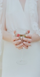 Rose Water
Photography: Elizabeth Messina
Read More:
http://www.insideweddings.com/weddings/ethereal-garden-inspired-morning-ceremony-alfresco-brunch/582/ Bride holding wine goblet of water with fresh rose