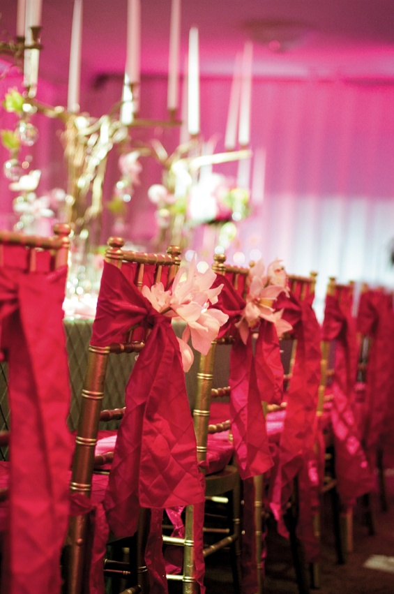 Pink Ribbon Chairs
Photography: Mermin + Christie Photographers
Read More:
http://www.insideweddings.com/weddings/tropical-theme-beach-wedding-in-naples-florida/184/ gold chairs wrapped with pink fabric