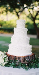 Wedding Cake
Photography: Jose Villa Photography
Read More:
http://www.insideweddings.com/weddings/california-oceanside-wedding-with-natural-elements/286/ White wedding cake with white sugar flowers on tree trunk