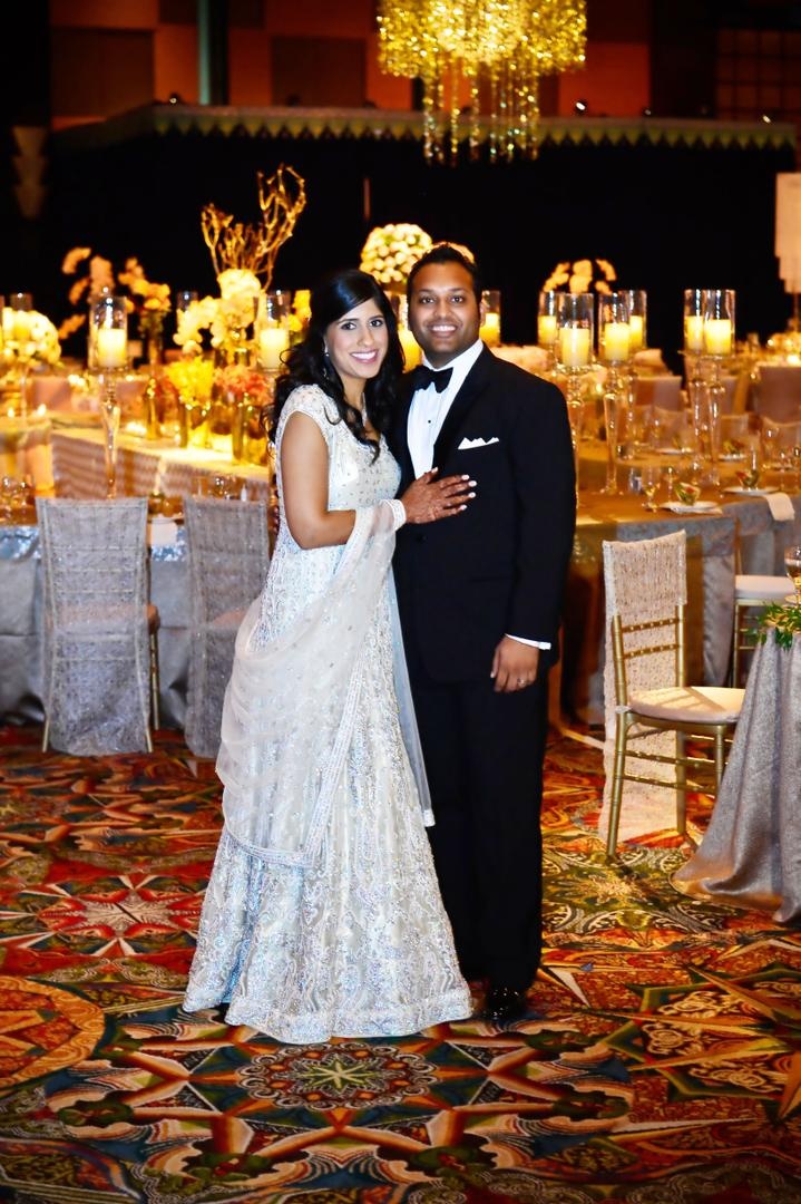 Bride and Groom
Photography: Tomas Ramos Photographers
Read More:
http://www.insideweddings.com/weddings/houston-indian-wedding-celebration-with-800-person-guest-list/435/ Bride in a beaded gown and groom in a black tuxedo