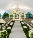 Elegant White %26 Green Tent Ceremony
Photography: Samuel Lippke Studios
Read More:
http://www.insideweddings.com/weddings/romantic-jewish-wedding-with-lush-ivory-flowers-rose-gold-details/790/ White drapes tent wedding with green hedge and white rose decor chuppah gold chairs chandeliers