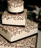 Brown Scroll Wedding Cake
Photography: Apertura Photo
Read More:
http://www.insideweddings.com/weddings/fall-california-wedding-with-european-inspired-details/215/ White four layer wedding cake with brown design