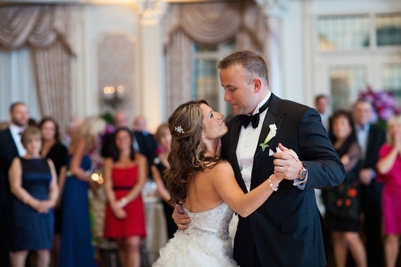 Newlywed's First Dance
Photography: Images by Berit, Inc.
Read More:
http://www.insideweddings.com/weddings/wedding-with-purple-modern-details-at-a-chateau-in-new-jersey/693/ Bride in a strapless Lazaro dress with beaded bodice dances with groom in black tuxedo
