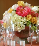 Vibrant Floral Centerpiece
Photography: Mark Staff Photography
Read More:
http://www.insideweddings.com/weddings/colorful-southern-spring-wedding-in-small-town-south-carolina/125/ Short centerpieces with abundance of flowers