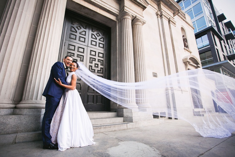 Bride with Gorgeous Cathedral Veil
Photography: Callaway Gable
Read More:
http://www.insideweddings.com/weddings/modern-in-the-round-ceremony-whimsical-garden-inspired-reception/1155/ Couple in front of vibiana in downtown los angeles long cathedral veil at a former cathedral
