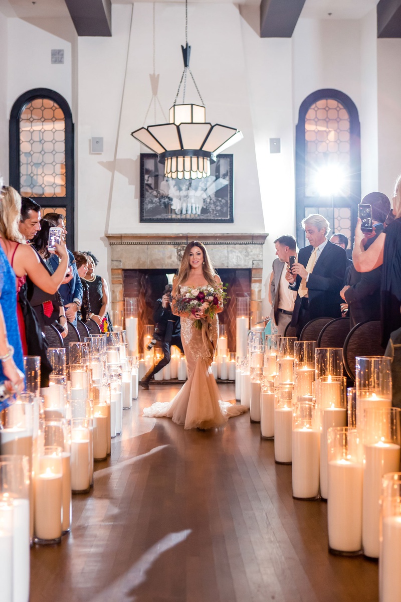 Guests Taking Photos of Processional
Photography: Maya Myers Photography
Read More:
http://www.insideweddings.com/weddings/candlelit-jewish-ceremony-unique-cozy-outdoor-reception-in-la/1346/ bride in blush inbal dror wedding dress fall bouquet candle lined aisle guests taking phone photos