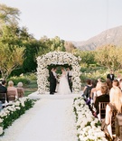 Lush Outdoor Ceremony
Photography: Elizabeth Messina
Read More:
http://www.insideweddings.com/weddings/georgetown-cupcake-cofounder-katherine-kallinis-california-wedding/405/ Bride and groom beneath chuppah at Santa Barbara wedding