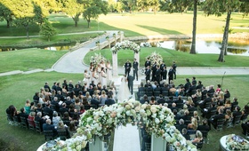 Dallas Country Club Wedding Ceremony
Photography: Samuel Lippke Studios
Read More:
http://www.insideweddings.com/weddings/elegant-alfresco-ceremony-ballroom-reception-in-dallas-texas/930/ Bride and father walk down aisle with guests at country club golf course in Dallas