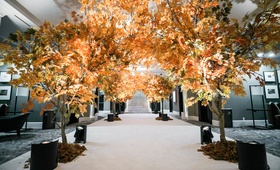 Entrance Lined with Fall Trees
Photography: Jessica Claire Photography
Read More:
http://www.insideweddings.com/weddings/50th-anniversary-party-with-fall-foliage-and-unique-performances/1068/ trees with fall foliage line entrance to reception