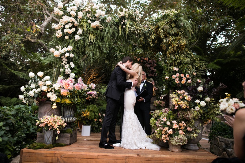 Bride %26 Groom Kiss Under Lush Chuppah
Photography: Samuel Lippke Studios
Read More:
http://www.insideweddings.com/weddings/tuscany-meets-rustic-california-outdoor-wedding-under-the-stars/1336/ wedding ceremony wood stage greenery white blush flowers chuppah first kiss jewish ceremony fall