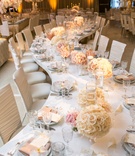 Serpentine Table
Photography: Jessica Claire Photography
Read More:
http://www.insideweddings.com/weddings/traditional-armenian-ceremony-luxurious-ballroom-reception/1006/ a long serpentine table with round white rose arrangements along the center