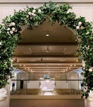 Greenery Arch for Ceremony Entrance
Photography: Deyla Huss Photography
Read More:
http://www.insideweddings.com/weddings/chic-wedding-with-sri-lankan-traditions-at-a-museum-in-portland/1332/ entrance to wedding ceremony with arch of greenery and a few white flowers