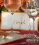 Orange %26 White Table Names
Photography: Paul Barnett Photographer
Read More:
http://www.insideweddings.com/weddings/colorful-celebration-with-sentimental-touches/316/ Wedding reception table with orange Brazil table name