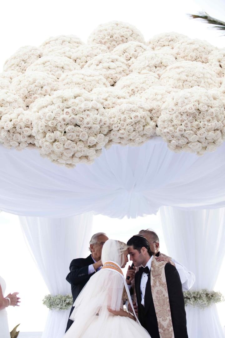White Rose Chuppah
Photography: Lauren Ross Photography %26 Nancy Cohn Photography
Read More:
http://www.insideweddings.com/weddings/sophisticated-breakers-wedding-with-pink-florals/335/ Bride and groom under wedding ceremony structure
