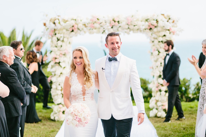 Bride %26 Groom at Oceanfront Ceremony
Photography: Jodee Debes Photography
Read More:
http://www.insideweddings.com/weddings/elegant-alfresco-ceremony-reception-with-parisian-elements/1176/ Bride and groom walking up aisle outdoor wedding ceremony guests clapping white pink flowers