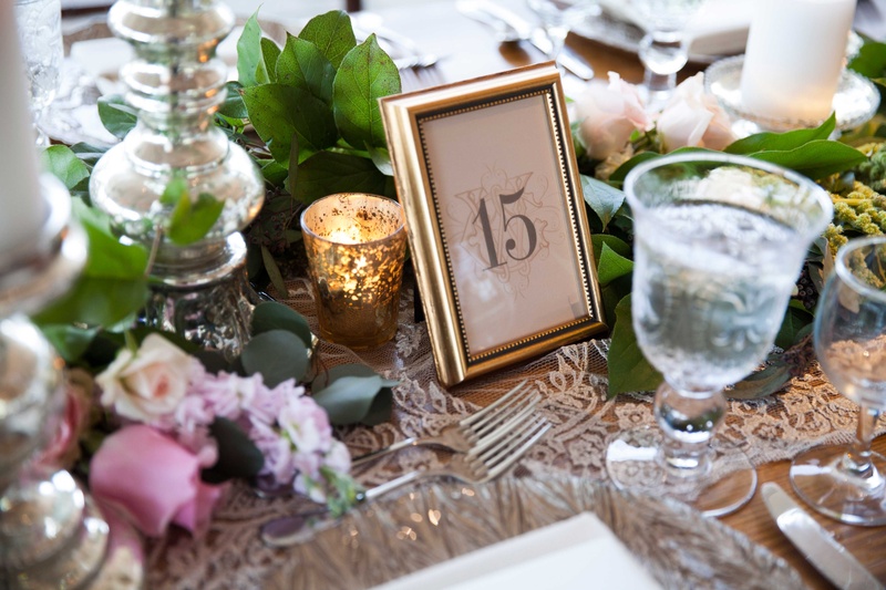 Garden Tablescape with Framed Table Numbers
Photography: Michael Bambino %26 Co.
Read More:
http://www.insideweddings.com/weddings/whimsical-open-air-secret-garden-wedding-with-soft-spring-hues/777/ A simple tablescape inspired Secret Garden with leafy table runner and gold frame table number