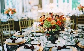 Fall-Inspired Wedding Centerpiece
Photography: M Bénédicte Verley Photography
Read More:
http://www.insideweddings.com/weddings/garden-wedding-at-lord-thompson-manor-in-connecticut/147/ Table with gold chargers and black urn filled with orange, green, and pink flowers