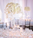Multi-Leveled Glass Centerpieces
Photography: Brian Leahy Photography
Read More:
http://www.insideweddings.com/weddings/oceanfront-interfaith-wedding-ceremony-with-classic-white-details/840/ tall glass vases, floating candle holders, candle centerpieces white wedding decoration ideas