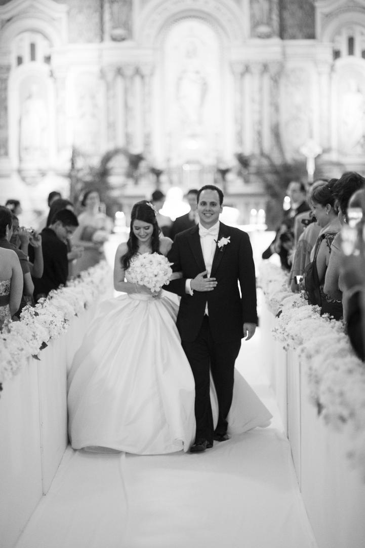 Newlyweds' Ceremony Recessional
Photography: Justin Marantz
Read More:
http://www.insideweddings.com/weddings/unforgettable-miami-wedding-with-acrobats-tiger-cubs-fireworks/437/ Black and white photo of couple walking up aisle