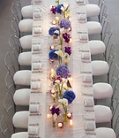Aerial View of Table
Photography: Bob %26 Dawn Davis Photography
Read More:
http://www.insideweddings.com/weddings/modern-purple-blue-white-wedding-at-contemporary-chicago-venue/541/ Bird's eye view of long white reception table