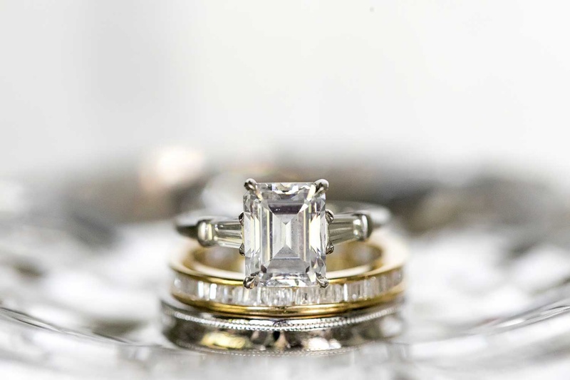 Emerald-Cut Ring with Side Stones
Photography: Vue Photography
Read More:
http://www.insideweddings.com/weddings/destination-rustic-fall-wedding-at-a-farm-in-north-carolina/1202/ emerald cut diamond engagement ring with tapered baguette diamond side stones gold eternity band