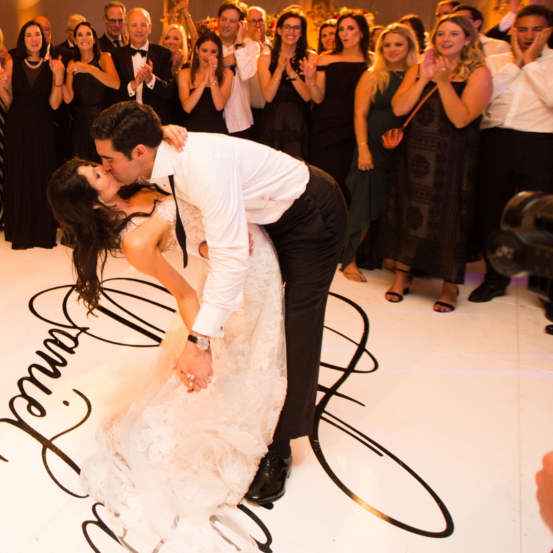 Bride %26 Groom's Kiss During First Dance
Photography: Jay Lawrence Goldman Photography
Read More:
http://www.insideweddings.com/weddings/outdoor-ceremony-ballroom-reception-with-pink-flowers-greenery/1135/ Wedding reception bride and groom dip and kiss during first dance on personalized dance floor names