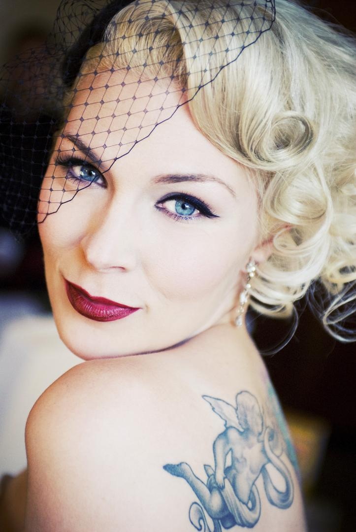 Bride in a Wedged Veil
Photography: Barnet Photography
Read More:
http://www.insideweddings.com/weddings/ashley-reeves-and-brandon-saller/261/ Bride in a black wedged veil and vintage look makeup