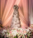 Six-Layer Blush Wedding Cake
Photography: Karlisch Photography
Read More:
http://www.insideweddings.com/weddings/luxury-hotel-wedding-with-personalized-elements-in-dallas-texas/1119/ Wedding cake on table with white orchid pink roses drapery blush cake with gold detailing frosting